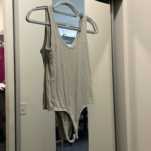 Lightly worn sage green v-neck bodysuit, size M